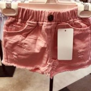 pink distressed shorts
